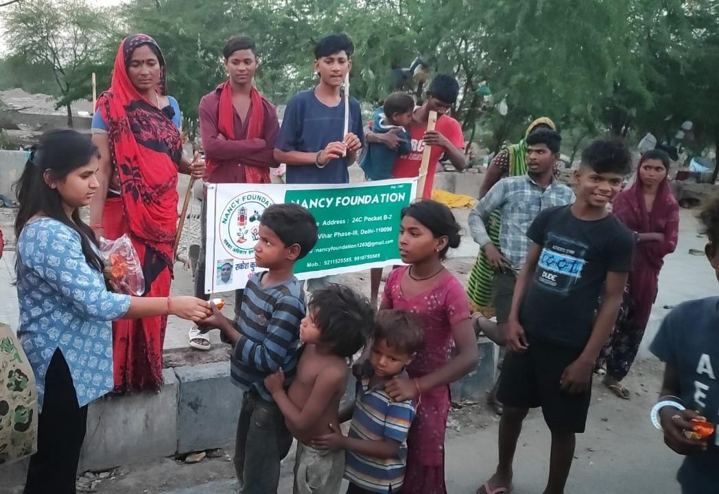 Volunteers distributing food to the needy.