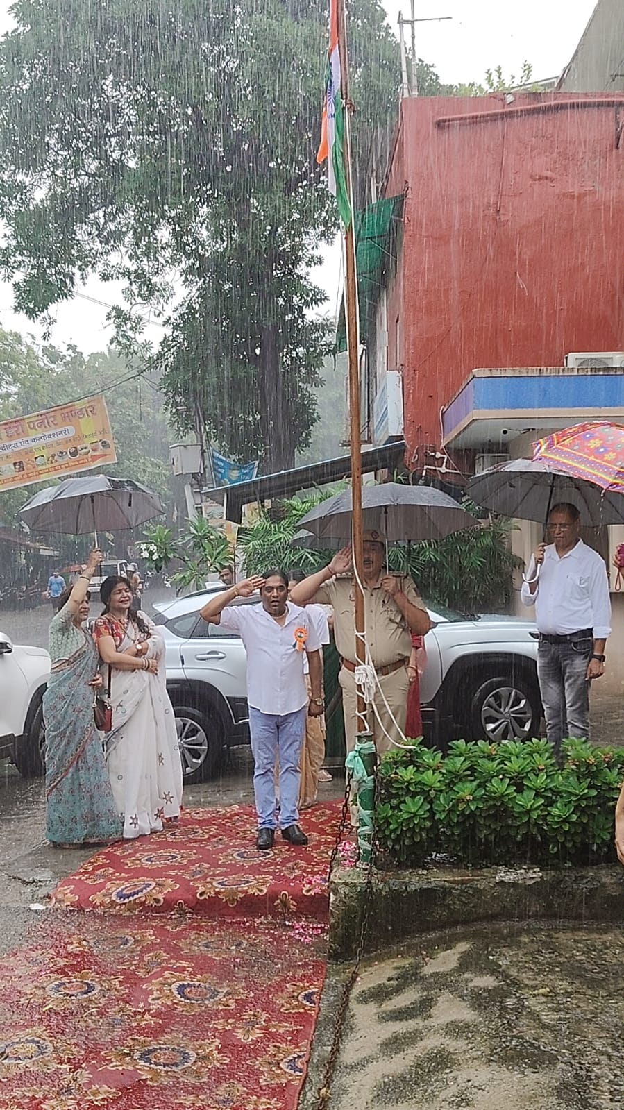 Children in a classroom receiving supplies.