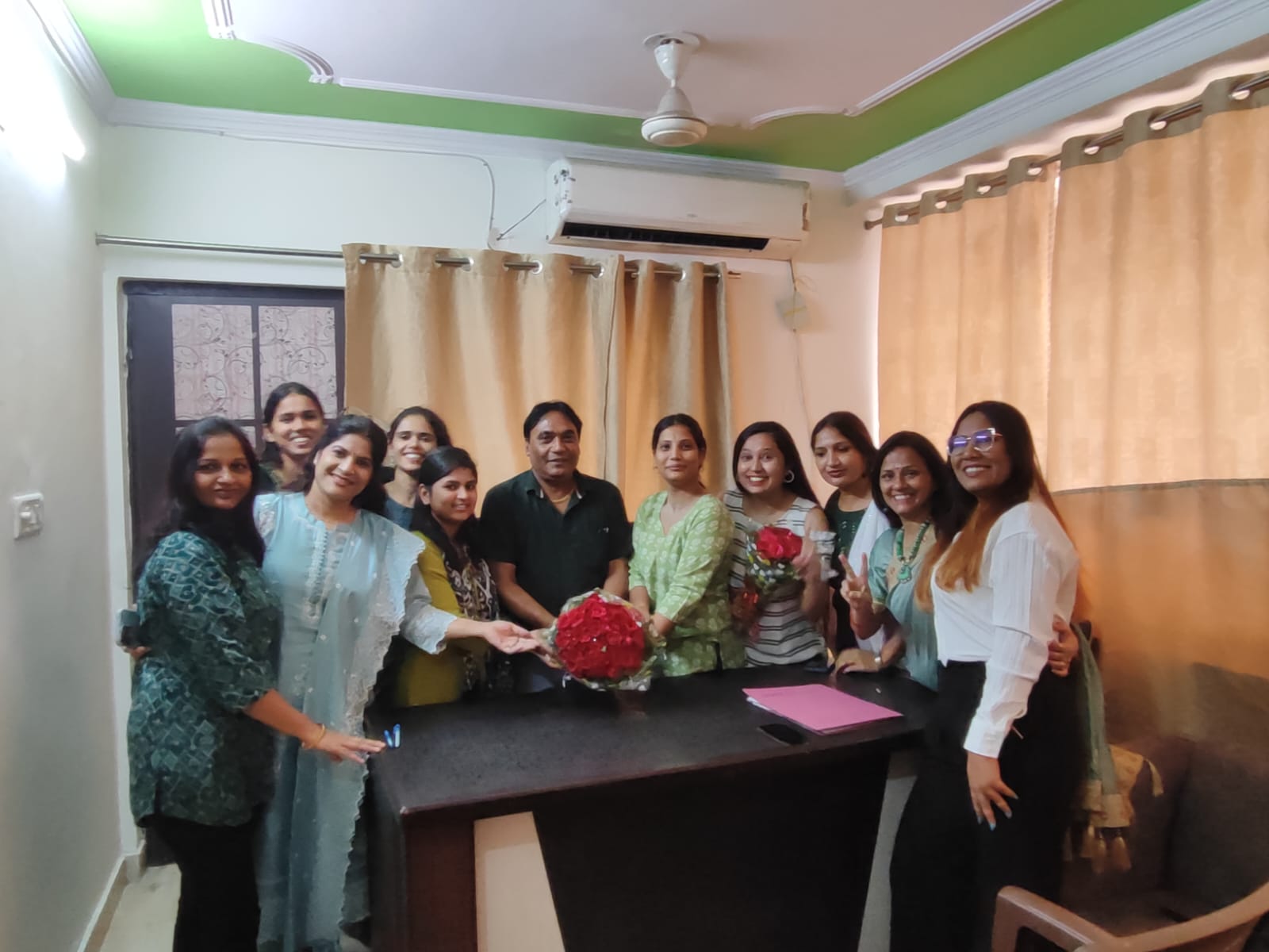 Children in a classroom receiving supplies.